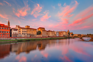 River Arno and famous bridge Ponte Vecchio at gorgeous sunrise in Florence, Tuscany, Italy