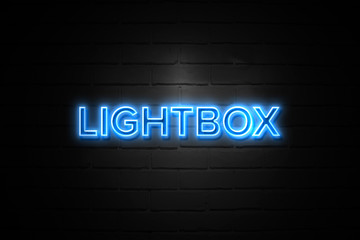 Obraz premium Lightbox neon Sign on brickwall