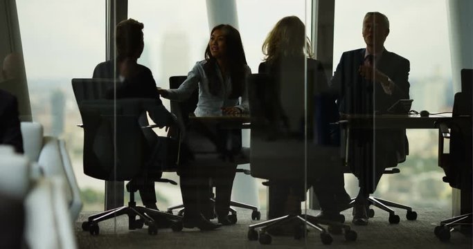 4K Corporate business team arguing in boardroom meeting in city office. Slow motion.