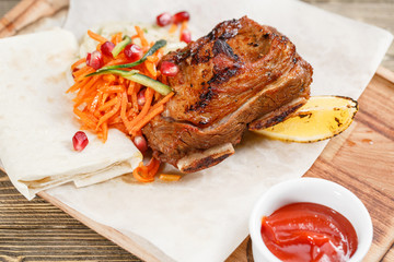 Beef ribs grill. Serving on a wooden Board on a rustic table. Barbecue restaurant menu, a series of photos of different meats
