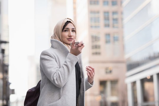 Woman in hijab talking on mobile phone