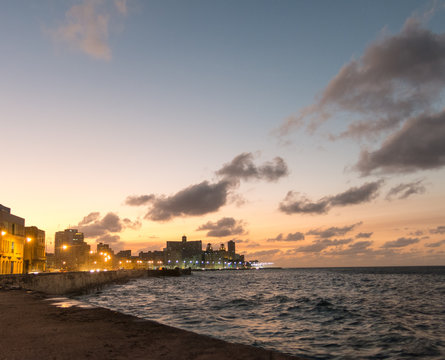 Sunset at Malecon, the famous Havana promenades. Cuba. At the bottom of the image, the National Hotel.