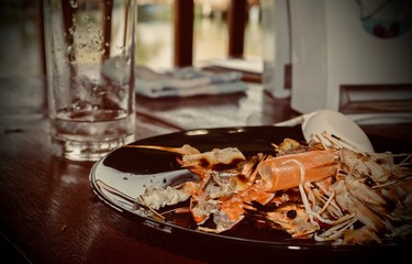 Naklejka na ściany i meble Shrimp on plate on table.
