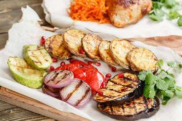 grilled vegetables. Serving on a wooden Board on a rustic table. Barbecue restaurant menu, a series of photos of different dishes