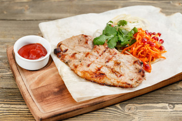 pork steak grill. Serving on a wooden Board on a rustic table. Barbecue restaurant menu, a series of photos of different meats