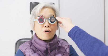 Old woman check on eye