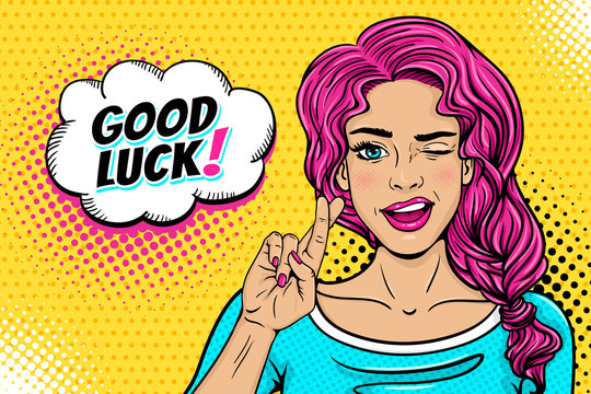 Pop art female face. Sexy young woman winks with pink hair and open smile, crossed fingers for luck symbol and Good Luck speech bubble on halftone. Vector colorful illustration in retro comic style.