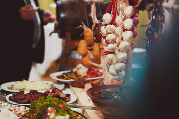 Catering service. Restaurant table with food. Huge amount of food on the table. Plates of food....
