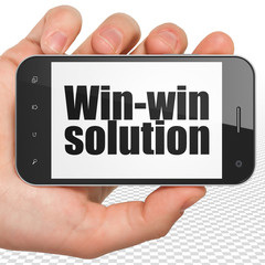 Finance concept: Hand Holding Smartphone with black text Win-win Solution on display, 3D rendering