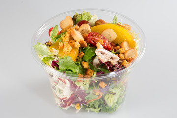 Fresh salad cup container on white background