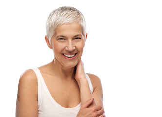 Portrait of a beautiful elderly woman, smiling, isolated on white background 