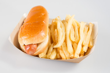 a hotdog in kraft carton with french fries in takeaway togo foodtruck