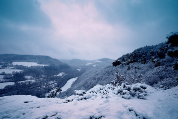 Fototapeta na wymiar Winter landscape, forest and mountains during the snowfall, winter dream and winter fairytale