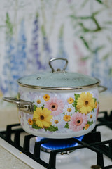 Elegant flower kitchen for workshop cooking with flower pan in hotel have a equipment luxury and closeup pot on the gas stove which has fire.