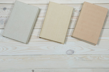 Pile of old pastel colors books stacked