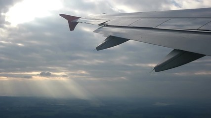 Cloudscape and plane wing