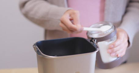 Making red pomegranate jam in machine