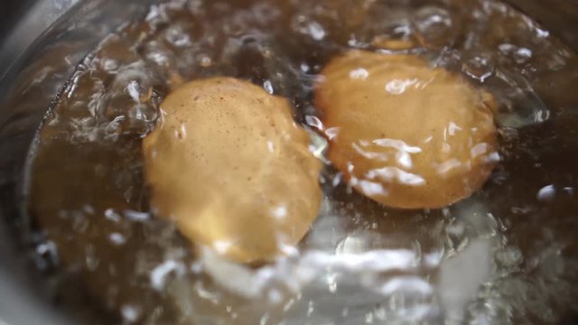 brown eggs boil in water