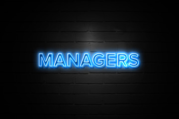 Managers neon Sign on brickwall