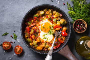 Fried egg with vegetables. 