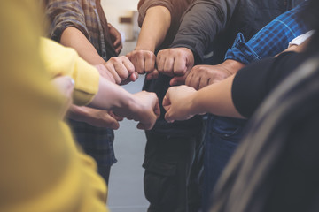 Group of business team work join their hands together with power and successful concept