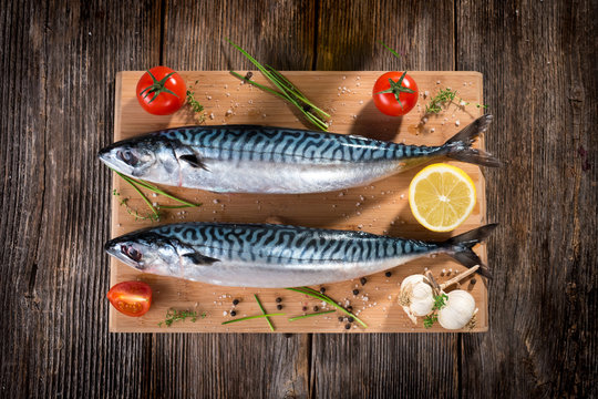 Fresh mackerel on wooden background