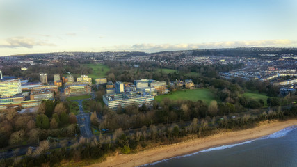 Fototapeta na wymiar Editorial Swansea, UK - February 4, 2018: Singleton Park, the major open parkland in the city, and Swansea University which has recently expanded with a campus near Jersey Marine