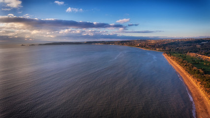 A view of the Swansea Bay, the gateway to the Gower peninsula, the UK's first Area of Outstanding Natural Beauty as it sweeps West from the University to Mumbles pier and lighthouse.