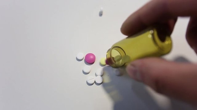 medical tablets close-up showered on the table
