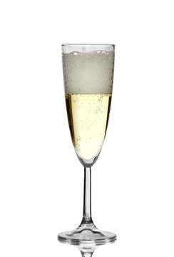 a glass of champagne with foam isolated on white background