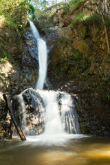 Fototapeta premium Scenic view on Mae Yen Waterfall with white water on a sunny day. Pai, Thailand.