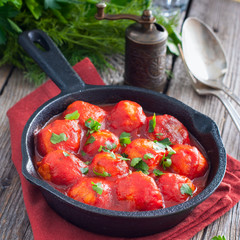 Meatballs in sweet and sour tomato sauce