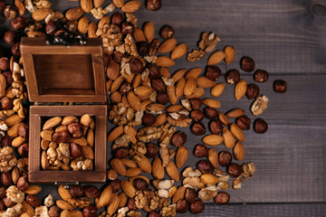 Wooden box full of nuts. Mix of hazelnuts, walnuts and almonds