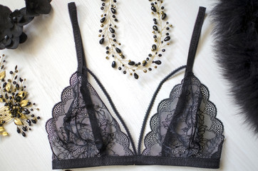 Close up lace lingerie on the white wooden background. Saxy black underwear. Fasion bra and women...