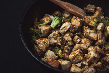 fried beef slices in a frying pan. menu restaurant recipe concept .