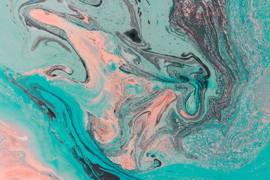 Creative ebru background with abstract painted waves. Beautiful liquid marbling texture. Contemporary art. Azure and pink colors. © torook