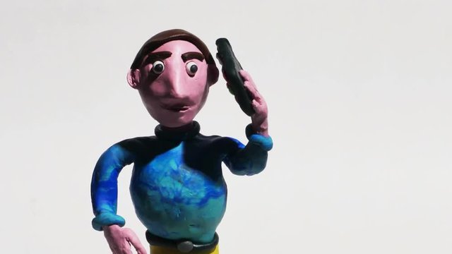 Man Using Smart Phone Clay Animation Isolated on White Close Up, 4K