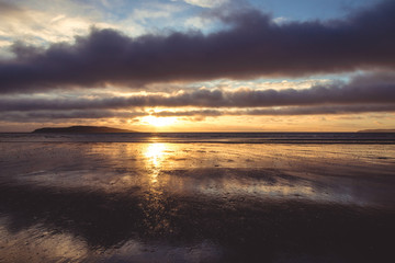 Yellow sunrise on beach in Rush Ireland