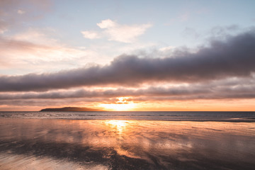 Orange beach sunrise in Rush Ireland