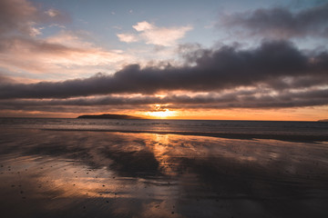 orange beach sunrise in Rush Ireland