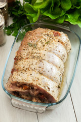 Marinated raw pork roll ready to roast