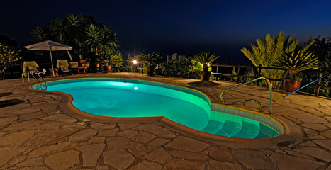 Private swimming pool at night