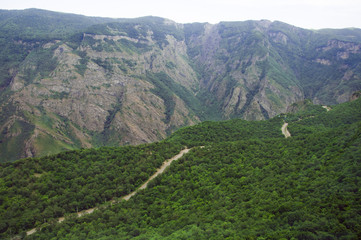 Fototapeta premium Mountain road serpentine through Syunik in Armenia route H45. Top view, landscape, view of the mountains.