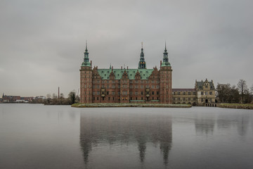 Fototapeta premium Reflections in the ice of the lake at Frederiksborg Castle