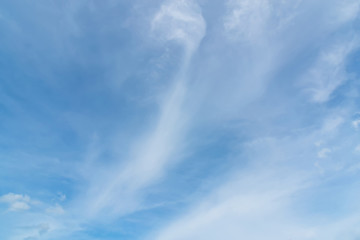Blue sky background with tiny clouds. White fluffy clouds in the blue sky - 191330254
