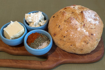 A typical Bulgarian breakfast - bread, butter, white cheese and spices - savory, salt and red pepper, one of the combinations called 
