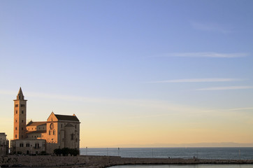 Fototapeta premium Church at the port of Trani, Italy, during sunset