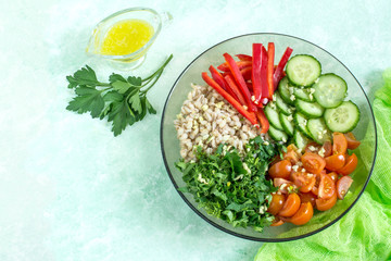 Obraz na płótnie Canvas Vegetarian lunch bowl with pearl barley and vegetables