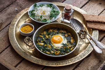 Iranian breakfast made with eggs, bean and dill