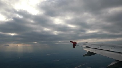 Cloudscape and plane wing